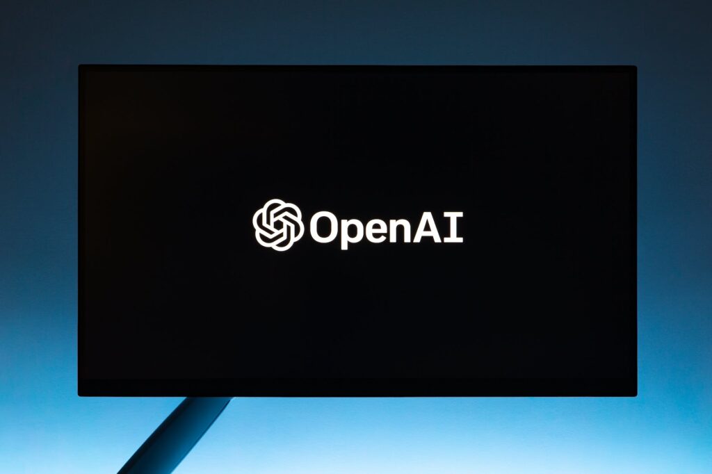 monitor screen with openai logo on black background